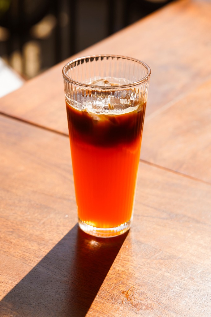 Aesthetic orange and espresso layered drink